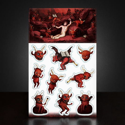 A photo of a Kiszkiloszki sticker sheet. The stickers include designs such as cute little red devils dancing and playing trumpets with their butts.