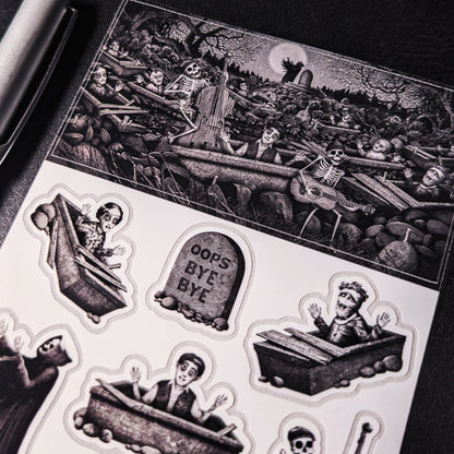 A close-up photo of a Kiszkiloszki sticker sheet. The stickers include designs such as happy peaople in their graves, dancing Death in a black robe, smiling skeletons playing music on guitar and double bass, a tombstone with "oops bye bye" sign on it.